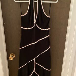 Pre-loved but in good condition. 100% polyester. Hits me mid-shin.